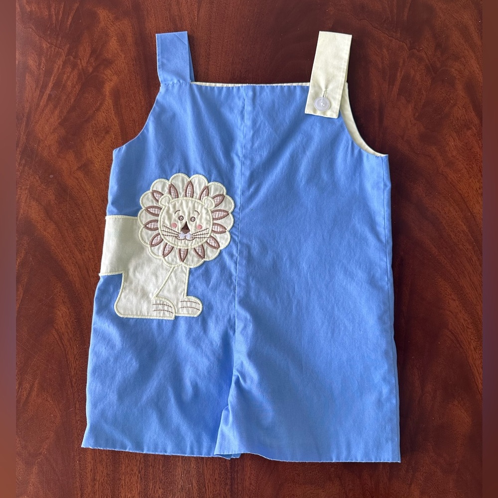 The Beaufort Bonnet Company Blue and Cream Lion Applique Romper